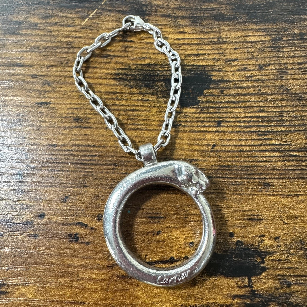 Cartier Silver Metal Panther Circle Keychain Bag Charm Engraved Pendant