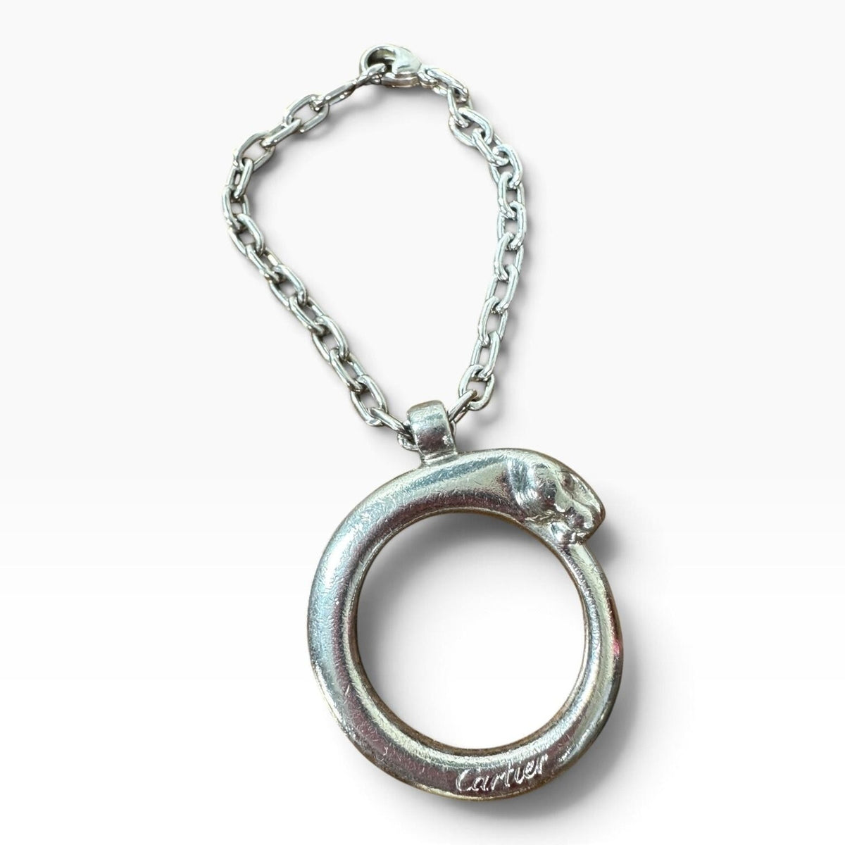 Cartier Silver Metal Panther Circle Keychain Bag Charm Engraved Pendant